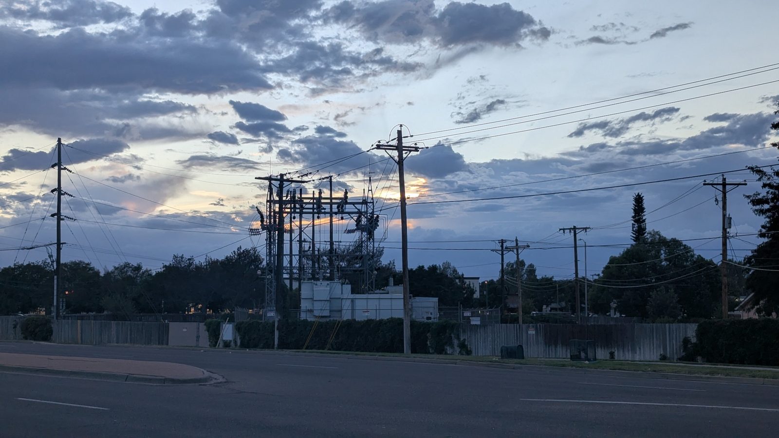 An electrical substation quietly handles the neighborhood’s less photogenic magic.