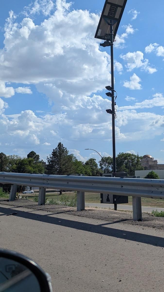 Camera tower beside a highway