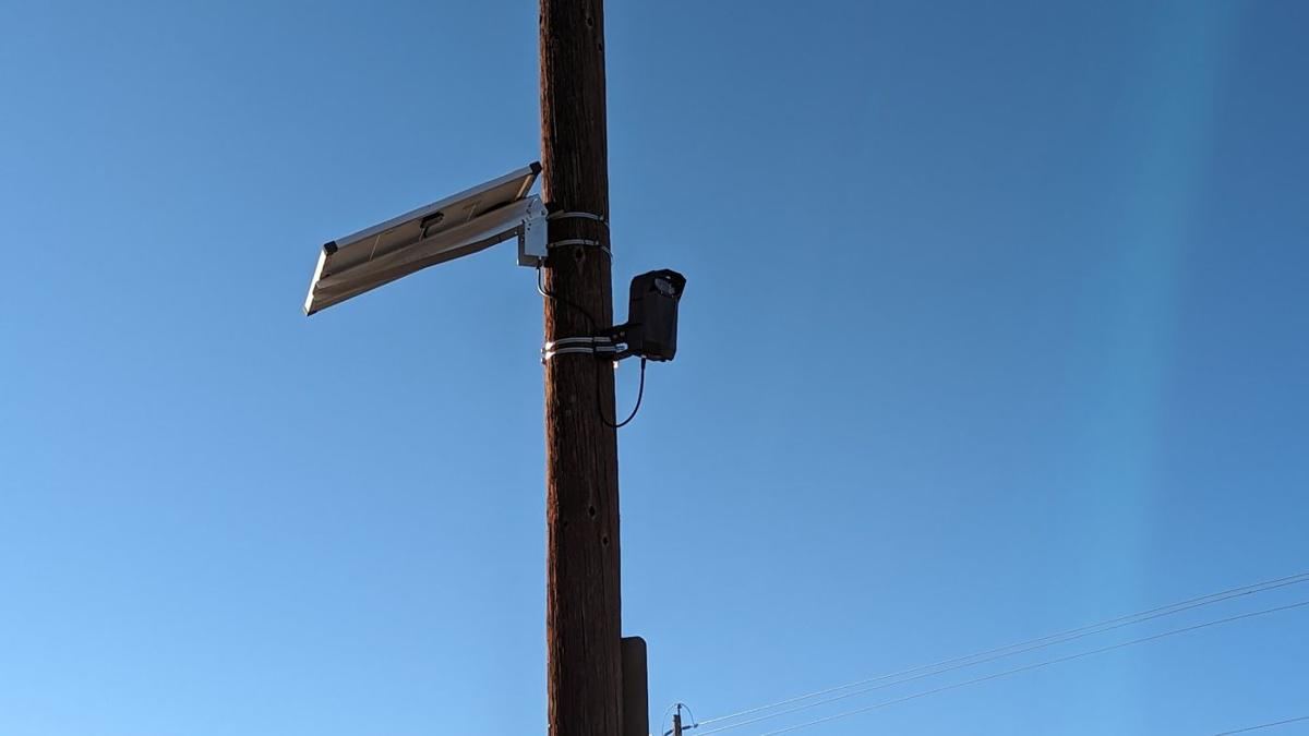 Solar panel and camera on a pole